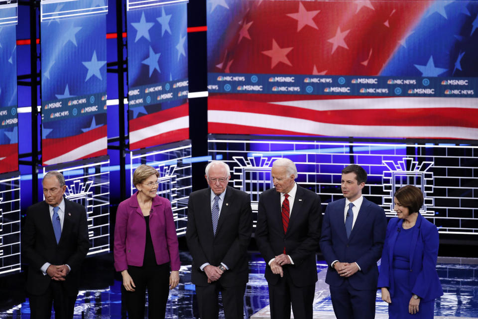 From left, Democratic presidential candidates, former New York City Mayor Michael Bloomberg, Sen. Elizabeth Warren, D-Mass., Sen. Bernie Sanders, I-Vt.,former Vice President Joe Biden, former South Bend Mayor Pete Buttigieg, Sen. Amy Klobuchar, D-Minn., stand on stage before a Democratic presidential primary debate Wednesday, Feb. 19, 2020, in Las Vegas, hosted by NBC News and MSNBC. (AP Photo/John Locher)