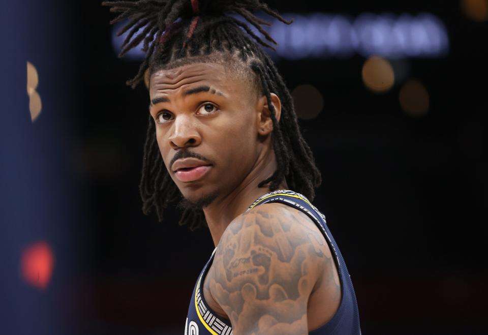 Memphis Grizzlies guard Ja Morant looks up at the score board during a stop in their play against the Denver Nuggets at FedExForum on Wednesday, Nov. 3, 2021. 