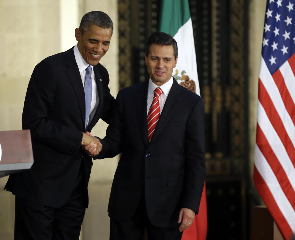 President Barack Obama, left, and Mexican President Enrique Pena Nieto shake hands following a news conference at the Palacio Nacional in Mexico City, Thursday, May 2, 2013.