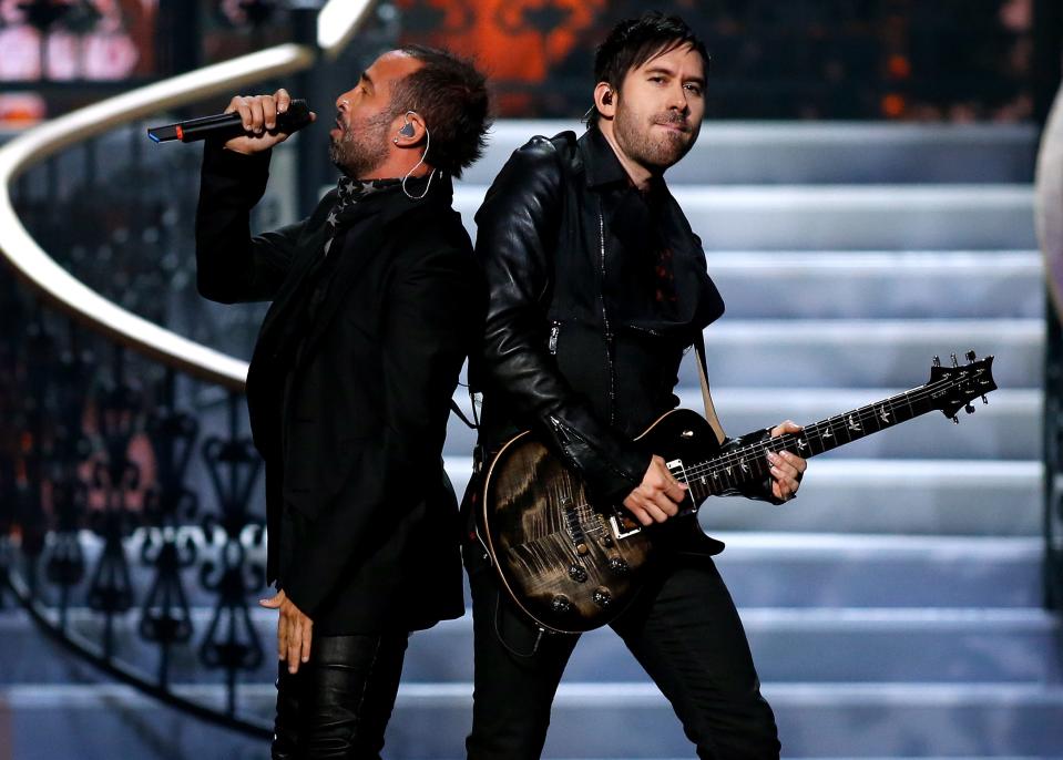 FILE - In this June 8, 2014 file photo, Pablo Hurtado, right, performs with fellow Camila band member Mario Domm at the Miss USA 2014 pageant in Baton Rouge, La.