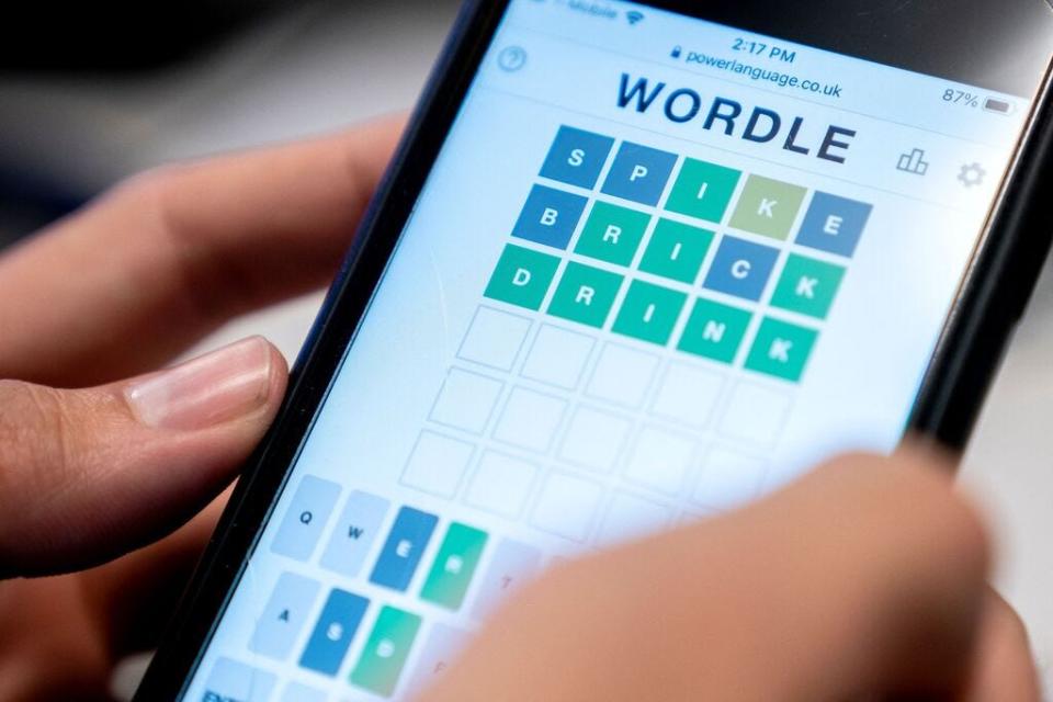 In this file illustration photo taken on January 11, 2022 a person plays online word game "Wordle" on a mobile phone.