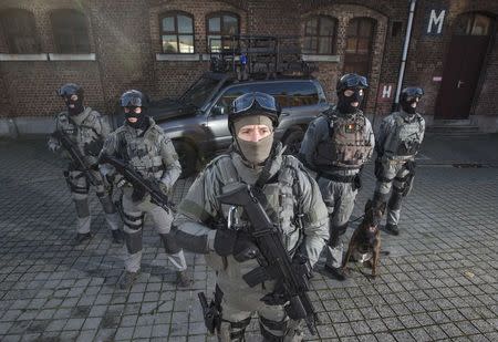 Members of Belgium's special forces pose for pictures at their headquarters in central Brussels November 24, 2014. REUTERS/Yves Herman