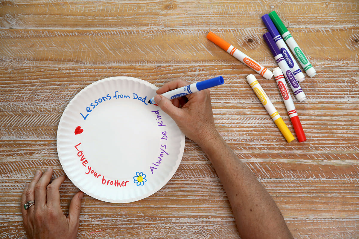 A photograph of a paper plate shows handwritten notes to dad.