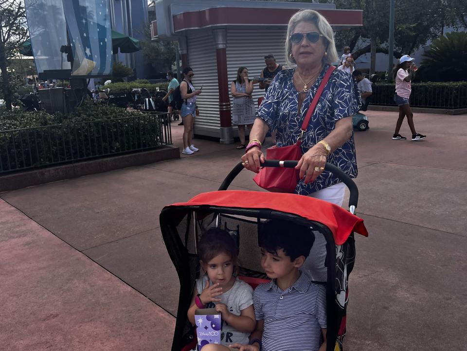 Woman pushing stroller at Disney