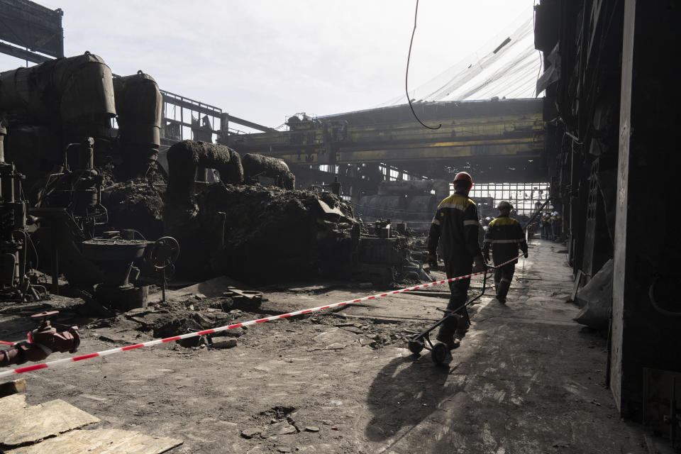 Workers walk inside DTEK's power plant which was destroyed by a Russian missile attack in Ukraine, on Tuesday, April 2, 2024. Russia is attacking Ukraine’s energy sector with renewed intensity and alarming accuracy, signaling to Ukrainian officials that Russia is armed with better intelligence and fresh tactics in its campaign to annihilate the country’s power generation capacity. (AP Photo/Evgeniy Maloletka)