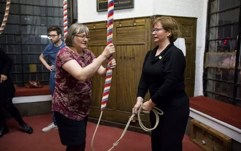 Experienced bell ringer Louise Booth shows the ropes to new recruit Leanne Masterdon, whose grandfather served in WW1 - Credit: Jeff Gilbert