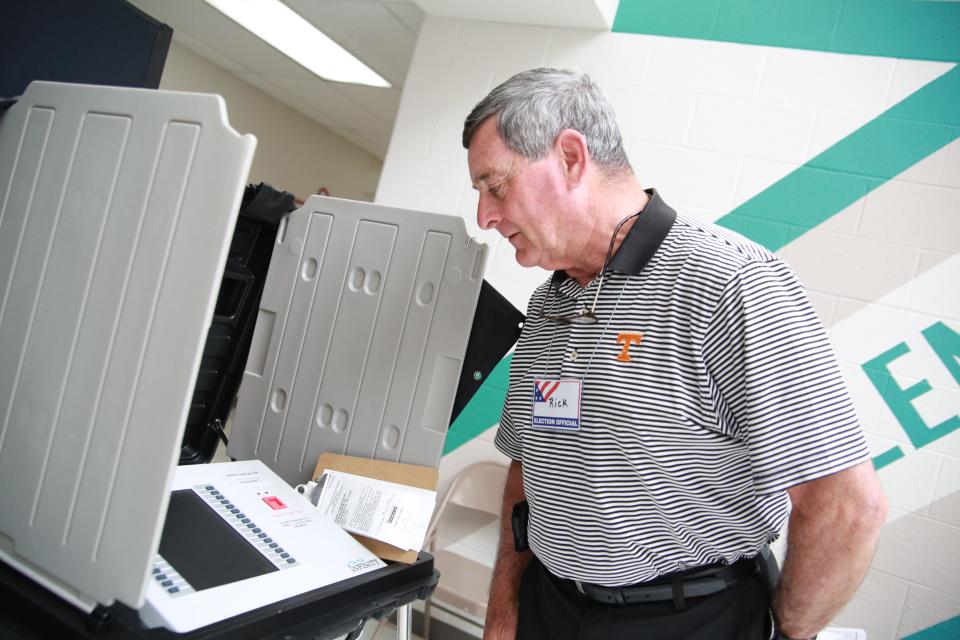 Glenellen School polling location Officer Rick Prall checks one of Glenellen's four voting machines between voters on May 3, 2022.