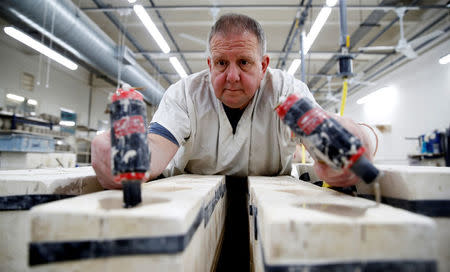 Clay is injected into moulds to make mugs commemorating the wedding of Britain's Prince Harry and Meghan Markle at the Emma Bridgewater Factory, in Hanley, Stoke-on-Trent, Britain March 28, 2018. REUTERS/Carl Recine