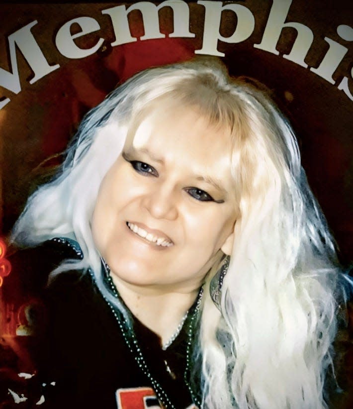 Cheryl Fitzgerald "in her glory," according to her sister, during a trip to Memphis to see Graceland. She died in 2022 after a stay in a residential care home, and now her estate is suing.