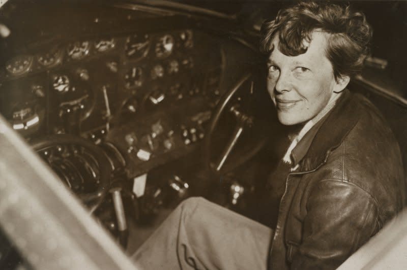 Aviator Amelia Earhart sites in the cockpit of her Electra airplane. Her plane went down in the Pacific on this day in 1937. UPI File Photo