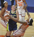 Connecticut Sun forward Emma Cannon goes down after a collision with Dallas Wings center Bella Alaire during a WNBA basketball game Tuesday, June 22, 2021 at Mohegan Sun Arena in Uncasville, Conn. (Sean D. Elliot/The Day via AP)