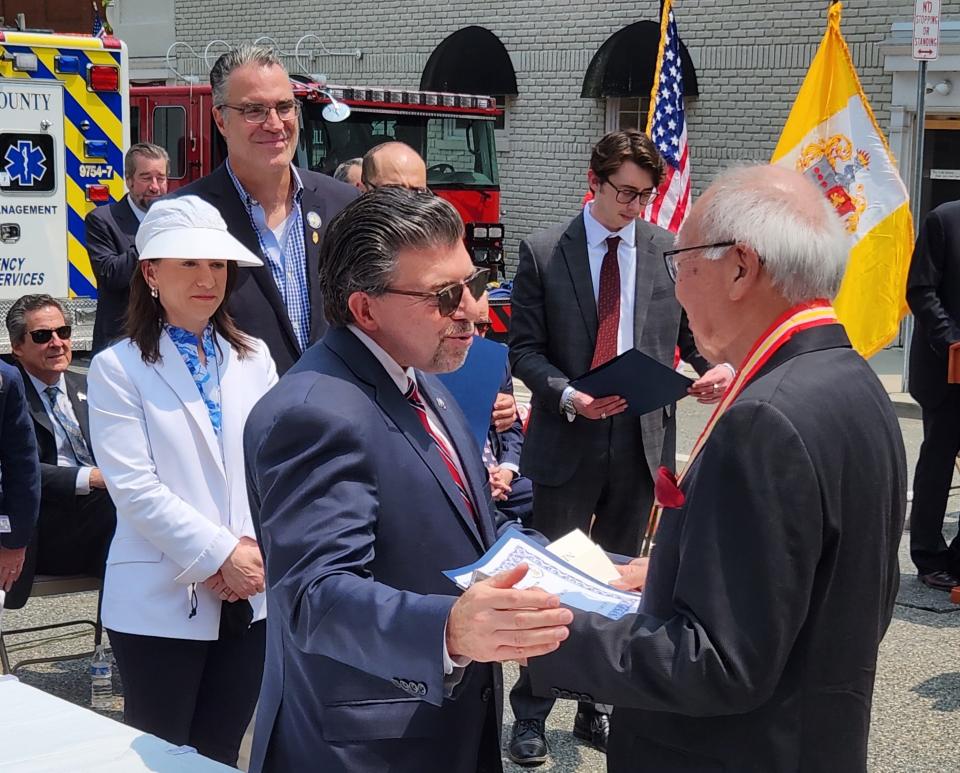 Sen. Tony Bucco, R-25th Dist., left, presents a certificate to David Okada, a Morris Township resident and Vietnam War veteran, during the annual Morris County Memorial Day observance at the county courthouse Wednesday, May 24, 2023.