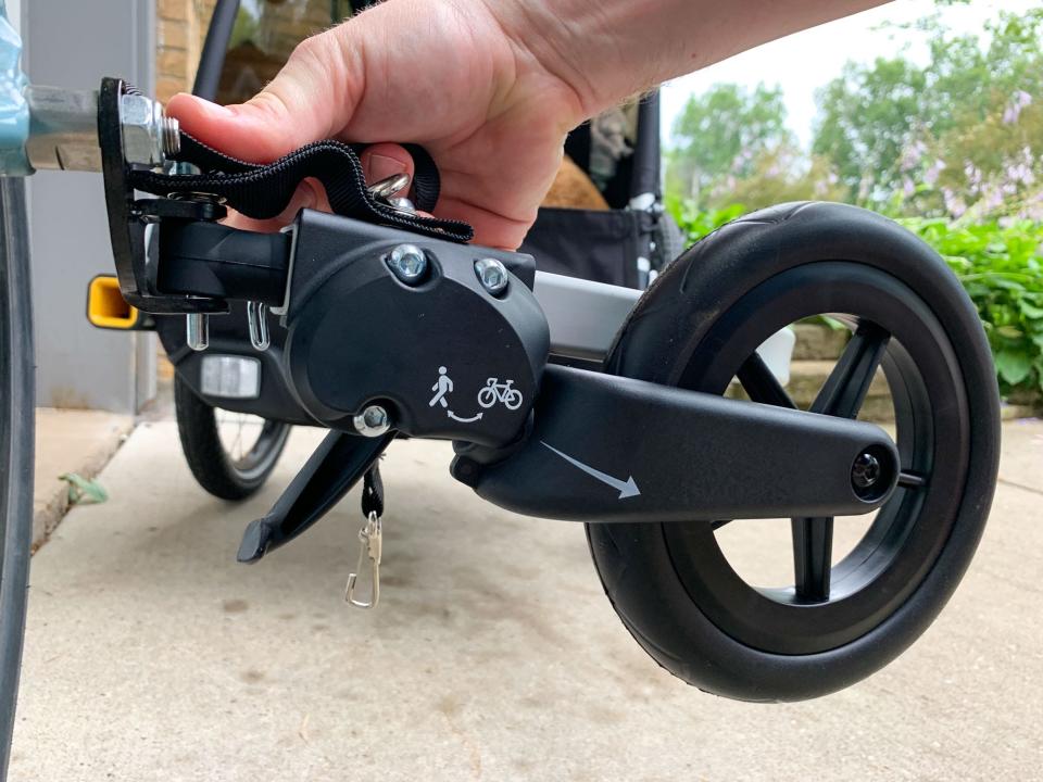 The tow bar's stroller wheel folds away on Burley's D'Lite X