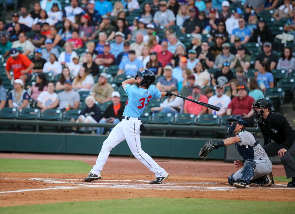 Hooks’ Justin Dirden (33) hits it deep in the Corpus Christi Hooks season opener against the San Antonio Missions on April 8, 2022 in Corpus Christi, Texas.