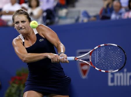 Timea Bacsinszky of Switzerland returns a shot to Venus Williams of the U.S. during their women's singles match at the U.S. Open tennis tournament in New York August 27, 2014. REUTERS/Shannon Stapleton