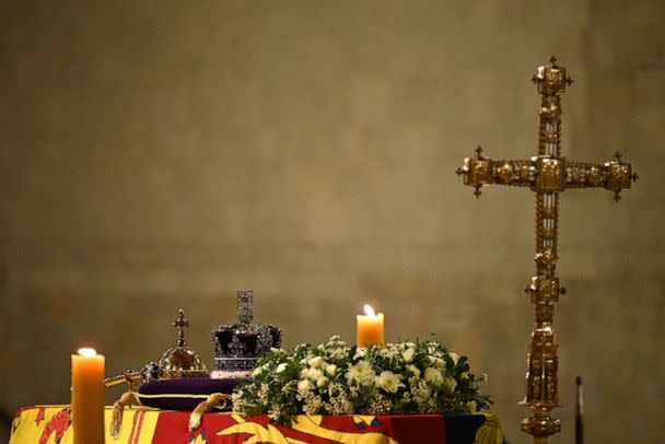 PHOTO: The coffin of Queen Elizabeth II, draped in a Royal Standard and adorned with the Imperial State Crown, is pictured inside Westminster Hall, at the Palace of Westminster, where it Lies in State on a Catafalque, in London, Sept. 14, 2022. (Ben Stansall/POOL/AFP via Getty Images)