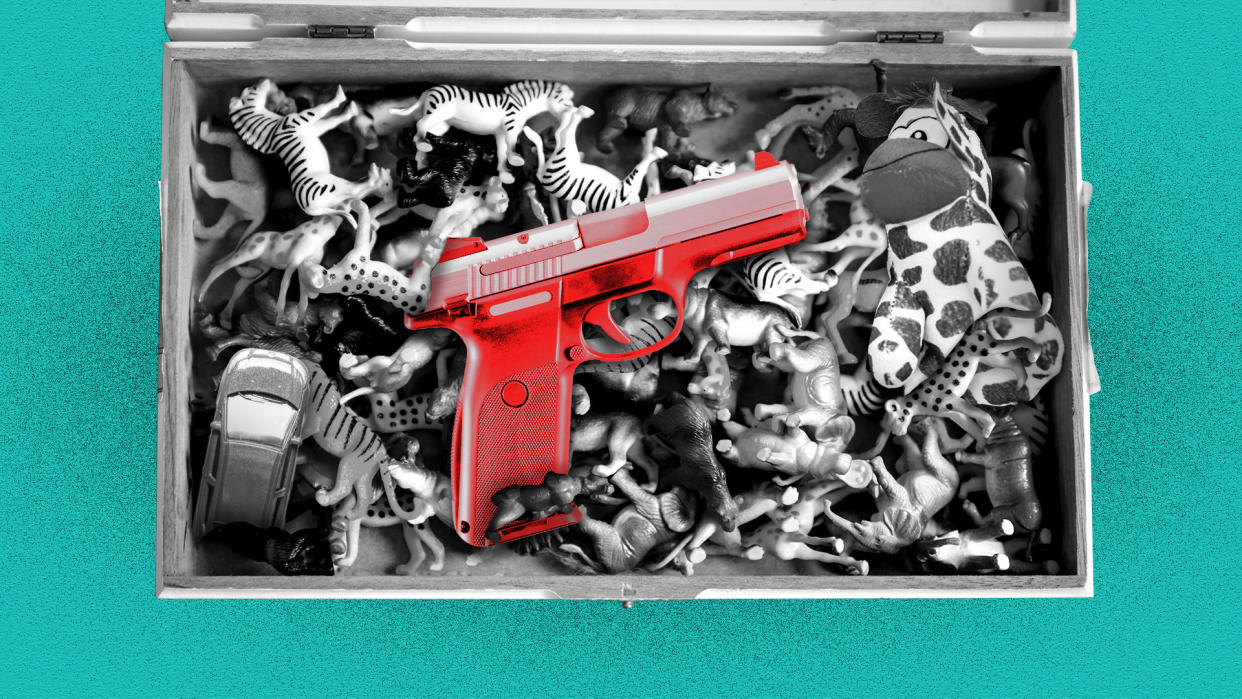 Black-and-white image of toys in a toy chest with image of red handgun superimposed over them.