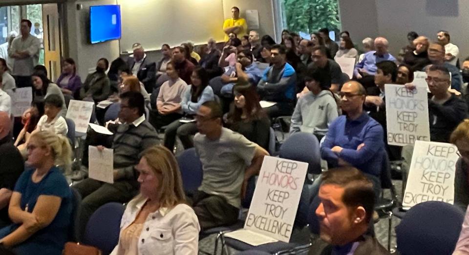 At a Troy schools board meeting on May 16, 2023, parents protest changes to math classes that would affect honors-track opportunities in middle school. At the three-hour meeting, the board voted 6-1 to approve the changes, despite the protests.