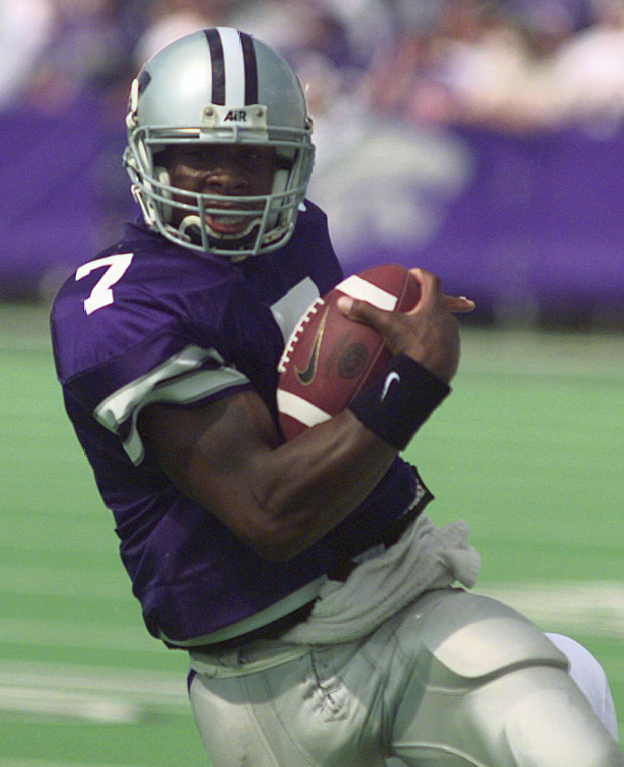 FILE - Kansas State quarterback Michael Bishop scrambles for 11 yards during the first half of an NCAA college football game against Texas, Saturday, Sept. 19, 1998, in Manhattan, Kan. Bishop was elected to the College Football Hall of Fame on Monday, Jan. 9, 2023. (AP Photo/Cliff Schiappa, File)