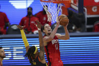 Houston Rockets center Kelly Olynyk, right, shoots against Golden State Warriors guard Damion Lee during the first half of an NBA basketball game in San Francisco, Saturday, April 10, 2021. (AP Photo/Jed Jacobsohn)