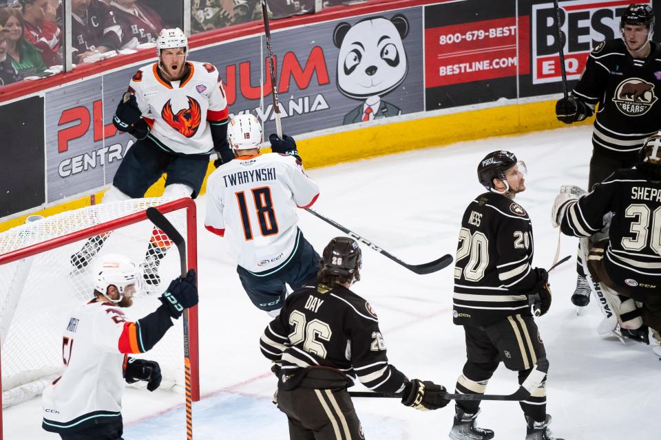 Coachella Valley's Austin Poganski (top left) celebrates after putting the Firebirds on the board with a first period goal in Game 4 of the Calder Cup Finals against Hershey at the Giant Center in Hershey, Pa., Thursday, June 15, 2023. The Bears won, 3-2, to even the series at two games apiece.