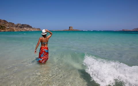 The number of visitors at La Pelosa beach is to be capped from next summer - Credit: Alamy