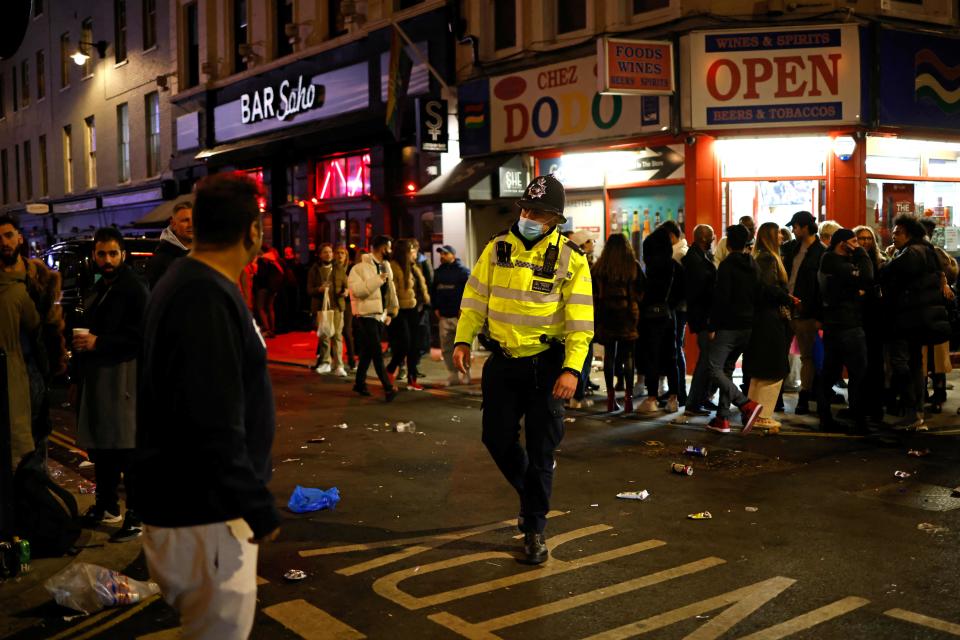 Police patrol the streets in Soho, London on Monday night as pubs reopened after the third lockdown  (AFP via Getty Images)