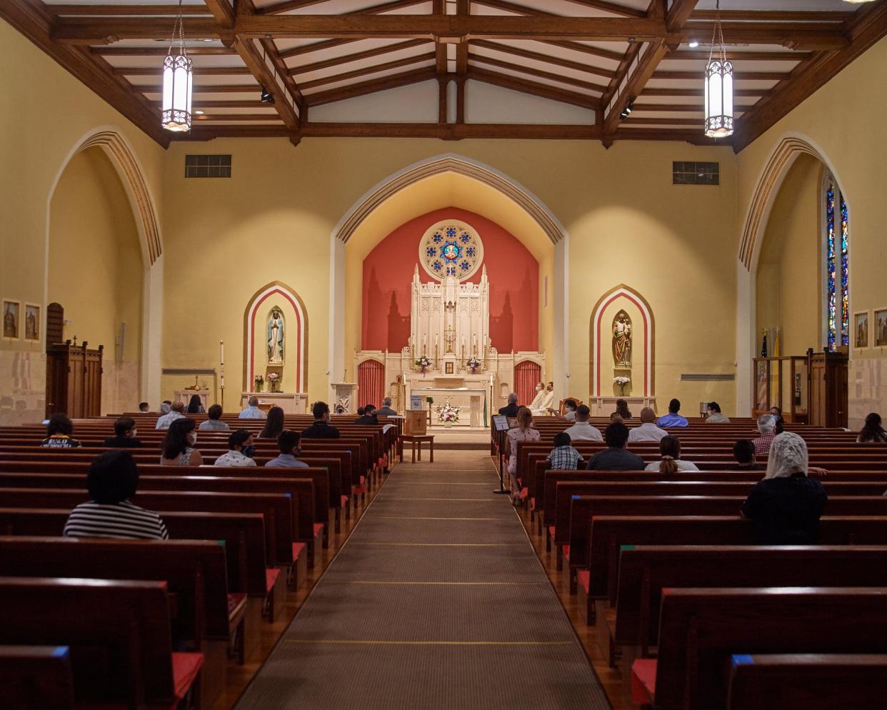 Parishioners practice social distancing at St. Matthew's in East Stroudsburg