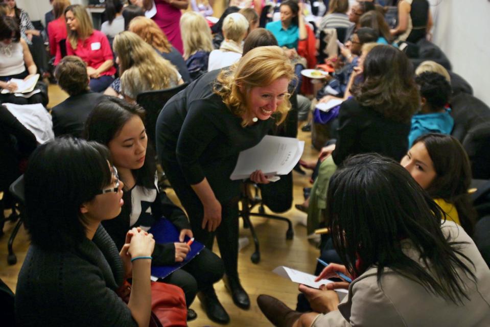 This April 16, 2013 photo provided by Wix Lounge shows organizer Mary Dove, talking to a group of women at a "lean in" meeting in New York. The group is inspired by Facebook COO Sheryl Sandberg's book "Lean In" which seeks to empower women in the workplace. (AP Photo/Wix Lounge, Galo Delgado)