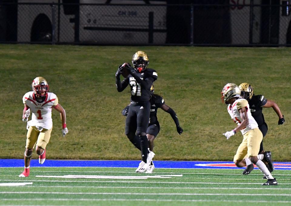 Abilene High linebacker Kenneth Johnson picks off a skipped Lubbock Coronado football Oct. 21 at Shotwell in Abilene. AHS won 35-14.