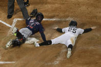 Minnesota Twins catcher Ben Rortvedt (70) looks to the home plate umpire for the call after tagging out Chicago White Sox's Andrew Vaughn (25) during the second inning of a baseball game Tuesday, May 11, 2021, in Chicago. (AP Photo/Paul Beaty)