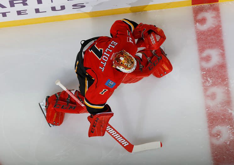 CALGARY, AB - OCTOBER 20: Brian Elliott #1 of the Calgary Flames stretches in warm up prior to the game against the Carolina Hurricanes at Scotiabank Saddledome on October 20, 2016 in Calgary, Alberta, Canada. (Photo by Gerry Thomas/NHLI via Getty Images)