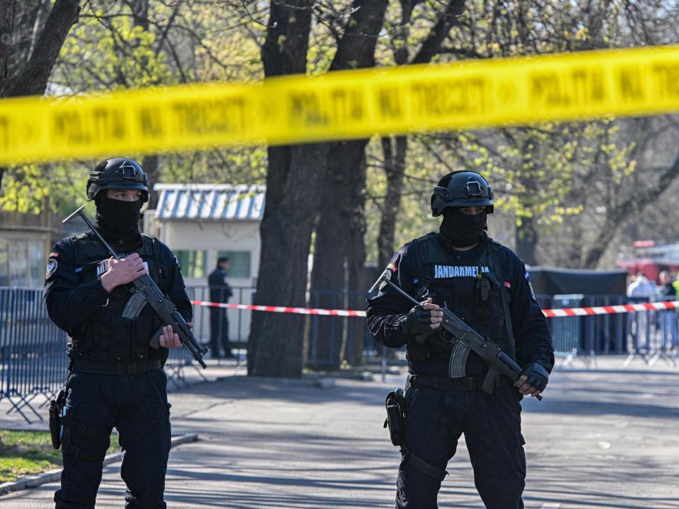 An image of the heavy police presence outside the Russian embassy in Romania following a fatal crash.