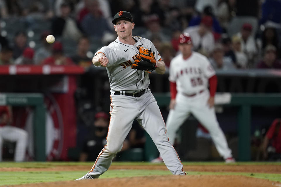 San Francisco Giants starting pitcher Anthony DeSclafani throws out Los Angeles Angels' Max Stassi at first base after a ground ball during the seventh inning of a baseball game Tuesday, June 22, 2021, in Anaheim, Calif. (AP Photo/Marcio Jose Sanchez)