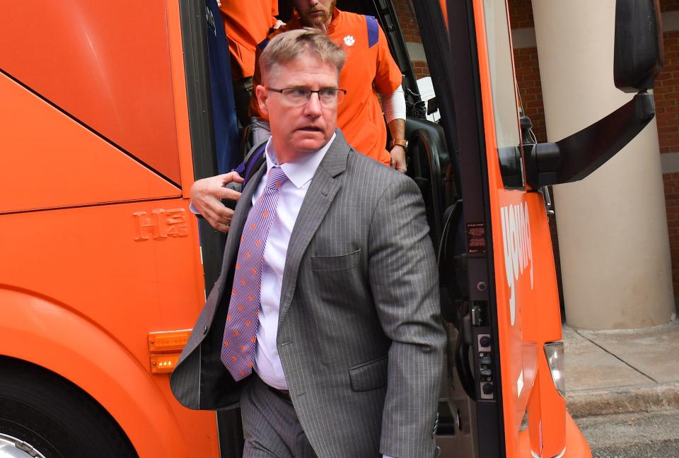 Clemson co-defensive coordinator Mickey Conn walks off the bus as the team arrives before the game with Wake Forest at Truist Field in Winston-Salem, North Carolina Saturday, September 24, 2022.  