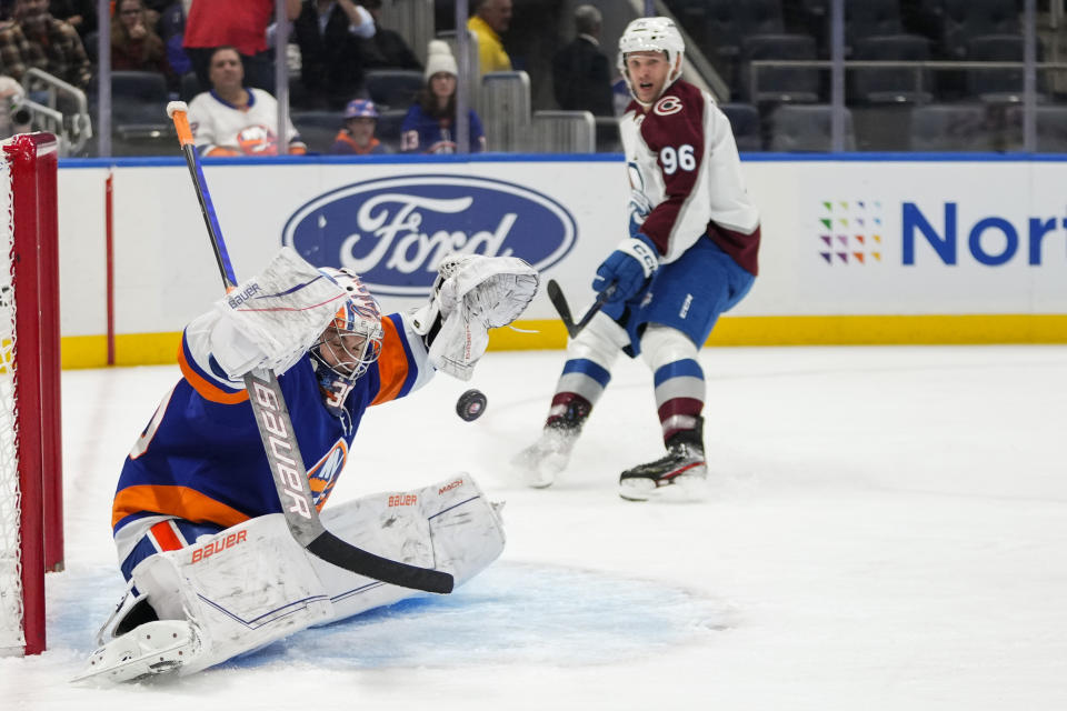 Colorado Avalanche's Mikko Rantanen (96) watches as a puck shot by Ryan Johansen gets past New York Islanders goaltender Ilya Sorokin (30) for a goal during the first period of an NHL hockey game Tuesday, Oct. 24, 2023, in Elmont, N.Y. (AP Photo/Frank Franklin II)