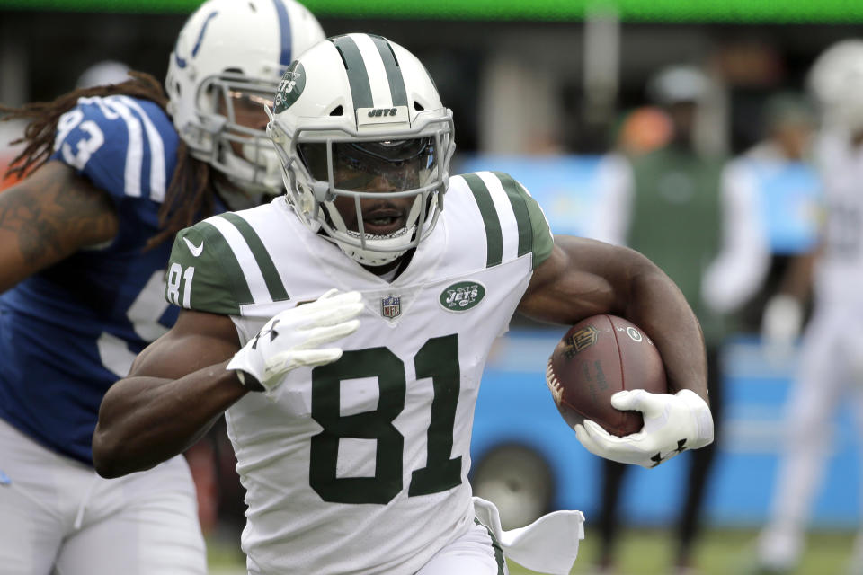 FILE - This Oct. 14, 2018, file photo shows New York Jets wide receiver Quincy Enunwa (81) running with the ball against the Indianapolis Colts during the first half of an NFL football game, in East Rutherford, N.J. A person with direct knowledge of the decision says the New York Jets are placing wide receivers Quincy Enunwa and Josh Bellamy on the reserve/physically unable to perform list. The moves Tuesday, May 5, 2020 effectively end each of the player's seasons with the Jets, four months before the season opener is scheduled. (AP Photo/Seth Wenig, File)