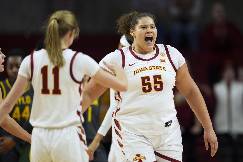 Iowa State center Audi Crooks (55) celebrates with teammate guard Emily Ryan (11) after making a basket during the first half of an NCAA college basketball game against Baylor, Saturday, Jan. 13, 2024, in Ames, Iowa. (AP Photo/Charlie Neibergall)