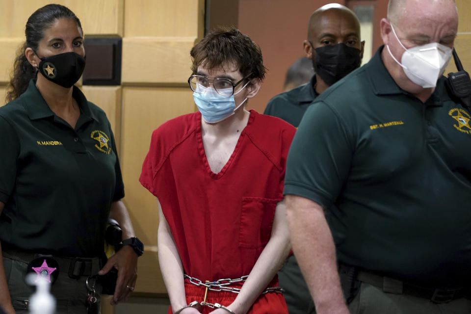 Marjory Stoneman Douglas High School shooter Nikolas Cruz enters the courtroom for a hearing at the Broward County Courthouse in Fort Lauderdale, Fla. on Monday, Nov. 15, 2021. Attorneys for Cruz told a judge Monday that detectives made false statements to get the search warrants allowing them to seize evidence from his cellphone and bedroom, including an argument over whether burgundy and maroon are the same color. (Amy Beth Bennett/South Florida Sun Sentinel via AP, Pool)