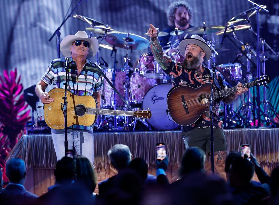 Alan Jackson, left, and Zac Brown perform during the 57th Annual Country Music Association Awards in Nashville on Nov. 8, 2023.