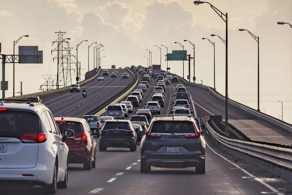 Vehicles head slowly east on the Interstate-10 twin spans leaving New Orleans while only a trickle of cars heads west back into the city before landfall of Hurricane Ida in New Orleans, Saturday, Aug. 28, 2021. A combination of voluntary and mandatory evacuations have been called for cities and communities across the region including New Orleans, where the mayor ordered a mandatory evacuation for areas outside the city’s levee system and a voluntary evacuation for residents inside the levee system.(AP Photo/Matthew Hinton)