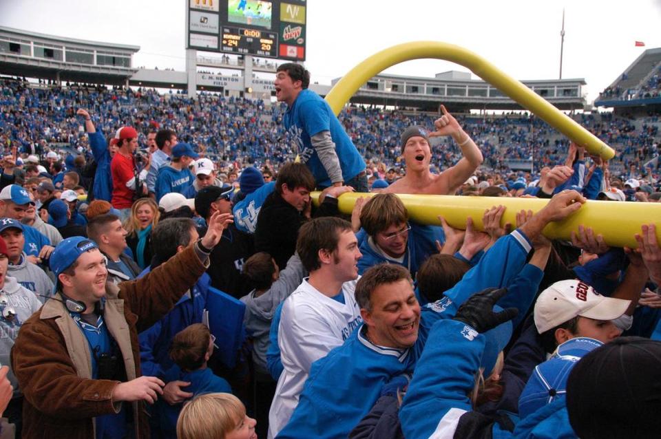 Kentucky fans carry a goal post around the field after it was torn down following the team’s 24-20 upset of Georgia on Nov. 4, 2006, at Commonwealth Stadium. A crowd of 62,120 watched what was UK’s first win against Georgia since 1996.