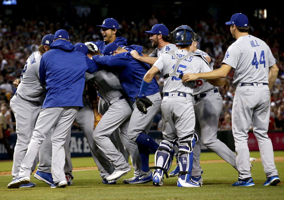 The Los Angeles Dodgers celebrate after game 3 of baseball’s National League Division Series against the Arizona Diamondbacks, Monday, Oct. 9, 2017, in Phoenix. The Dodgers won 3-1 to advance to the National League Championship Series. (AP)