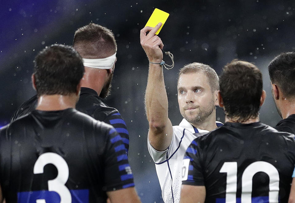 Argentina's Marcos Kremer, second left, is shown a yellow card by referee Angus Gardner during their Tri-Nations rugby union match against Australia in Sydney, Australia, Saturday, Dec. 5, 2020. (AP Photo/Rick Rycroft)