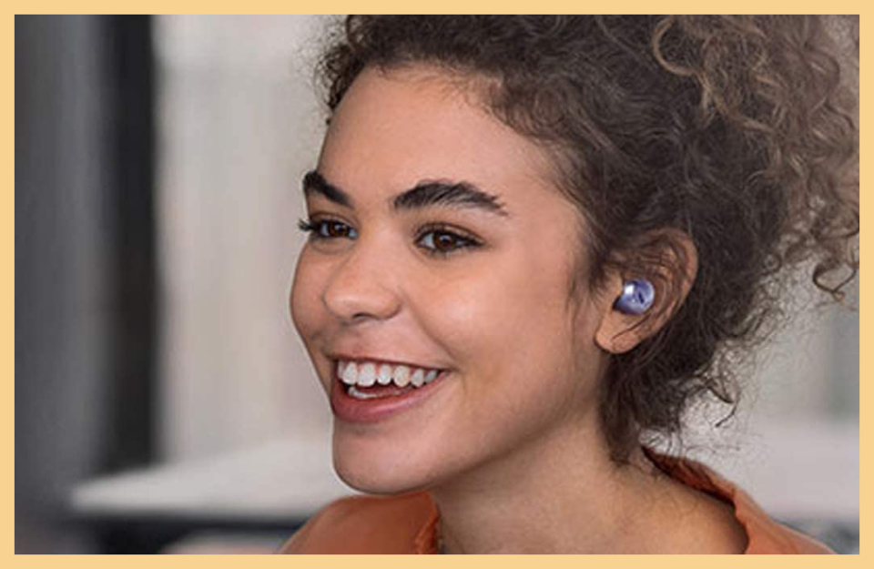 woman wearing ear buds