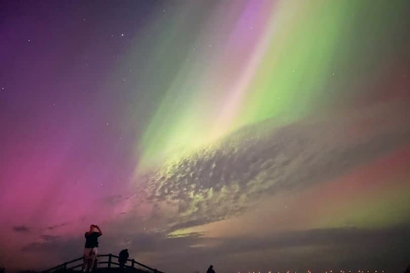 The aurora borealis, also known as the northern lights, glowing in the sky at Mappleton, East Yorkshire.