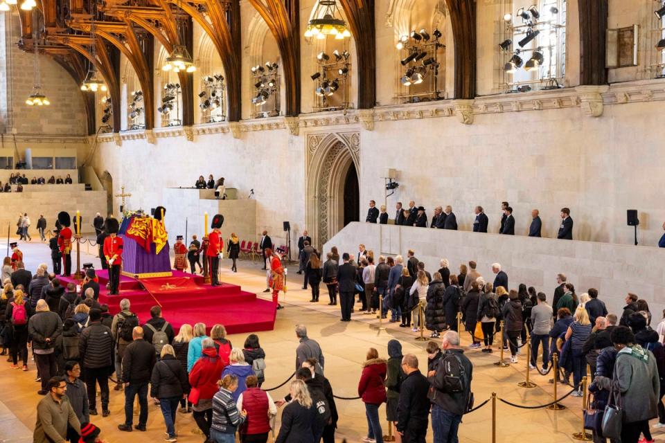 People pay respects to Queen Elizabeth as she lies in state in Westminster Hall (via REUTERS)