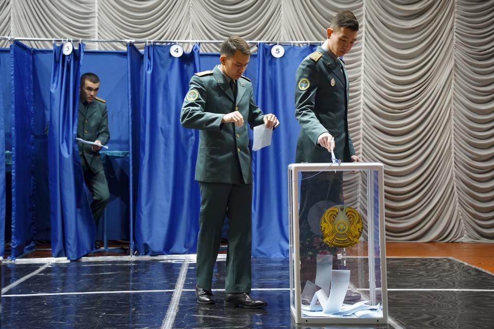 National servicemen cast their votes at a polling station in Almaty, Kazakhstan, Sunday, Nov. 20, 2022. Kazakhstan's president appears certain to win a new term against little-known challengers in a snap election on Sunday. Five candidates are on the ballot against President Kassym-Jomart Tokayev, who faced a bloody outburst of unrest early this year and then moved to marginalize some of the Central Asian country's longtime powerful figures. (Vladimir Tretyakov/NUR.KZ via AP)