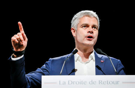 FILE PHOTO: Laurent Wauquiez, the front-runner for the leadership of French conservative party "Les Republicains" (The Republicans) attends a political rally in Saint-Priest, near Lyon, France, December 7, 2017. REUTERS/Robert Pratta/File Photo