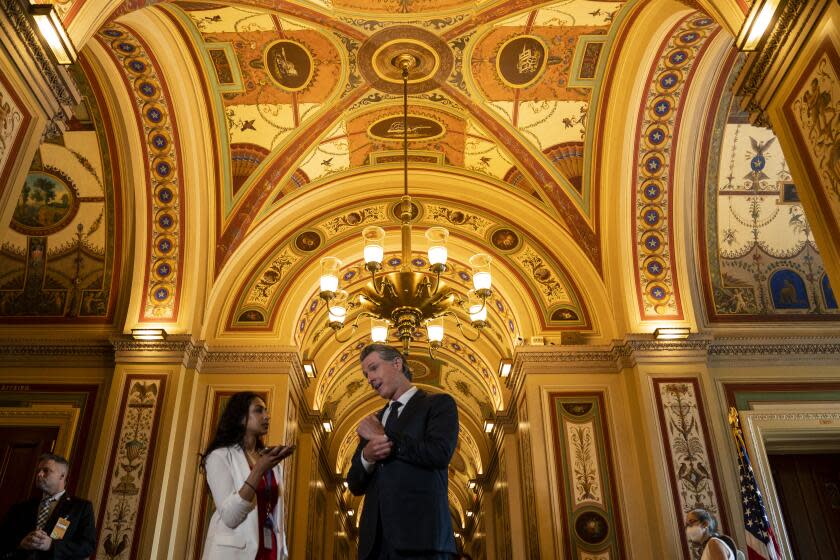 WASHINGTON, DC - JULY 14: Capitol Hill intern for NBC news Sejal Govindarao asks California Governor Gavin Newsom questions on the Senate side of the U.S. Capitol Building following the governors meeting with Sen. Amy Klobuchar (D-MN) on Thursday, July 14, 2022 in Washington, DC. Governor Newsom is continuing a visit to Washington after accepting an award recognizing California's financial investments in public education and holding meetings with White House officials and lawmakers on Capitol Hill. (Kent Nishimura / Los Angeles Times)